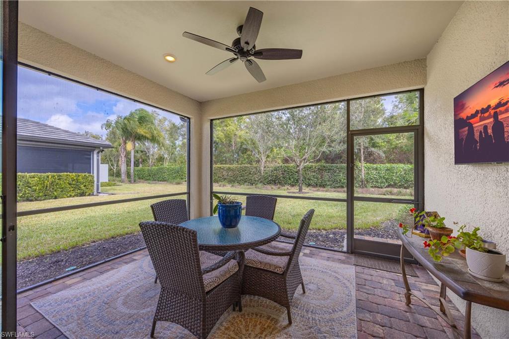 7658 Jacaranda Lane Naples, FL 34114 - Photo 19 of 30 Large covered lanai featuring outdoor dining space