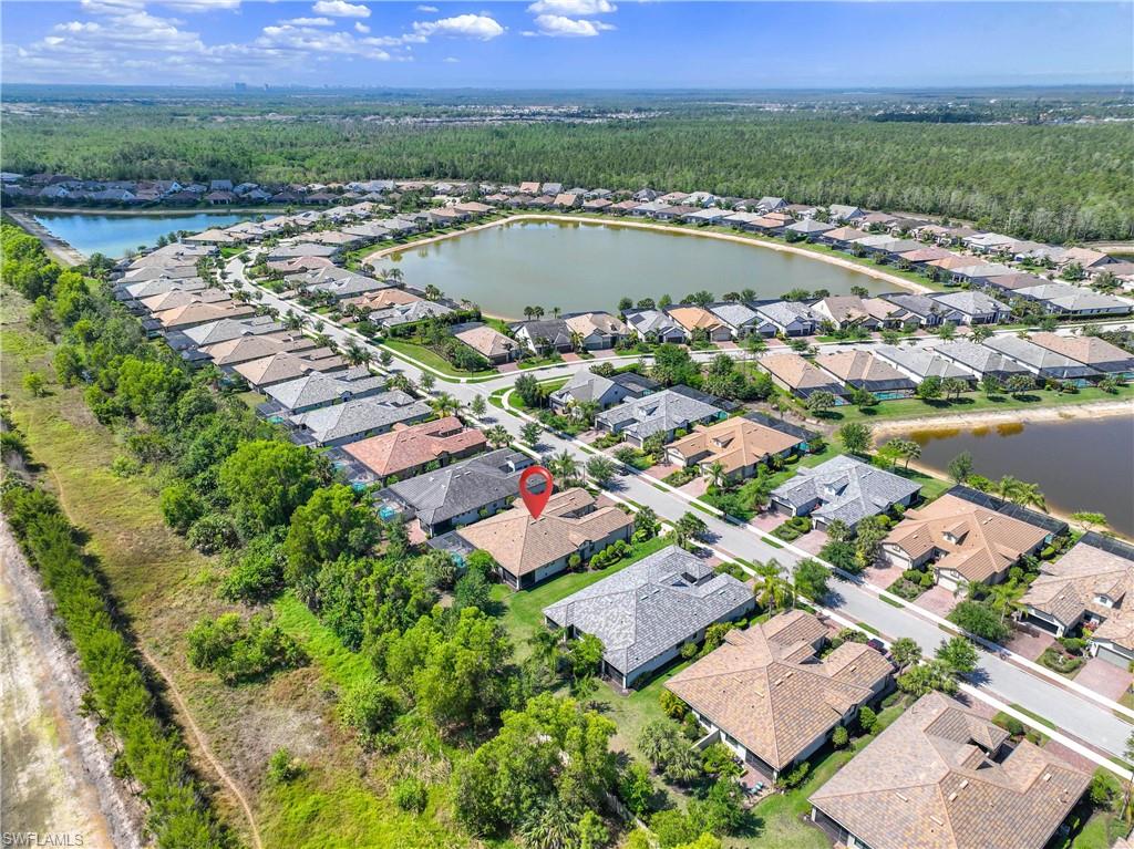 7658 Jacaranda Lane Naples, FL 34114 - Photo 21 of 30 Aerial overview of property's location with a large body of water and nearby suburban area