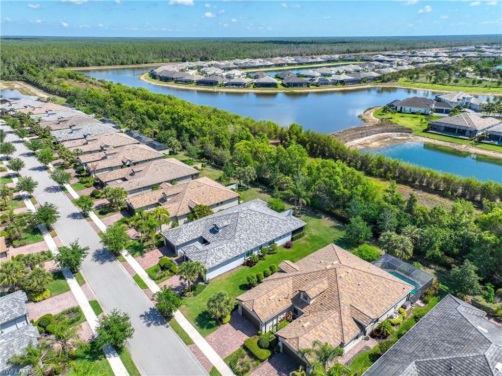 7658 Jacaranda Lane Naples, FL 34114 - Photo 23 of 30 Aerial perspective of property with large side yard