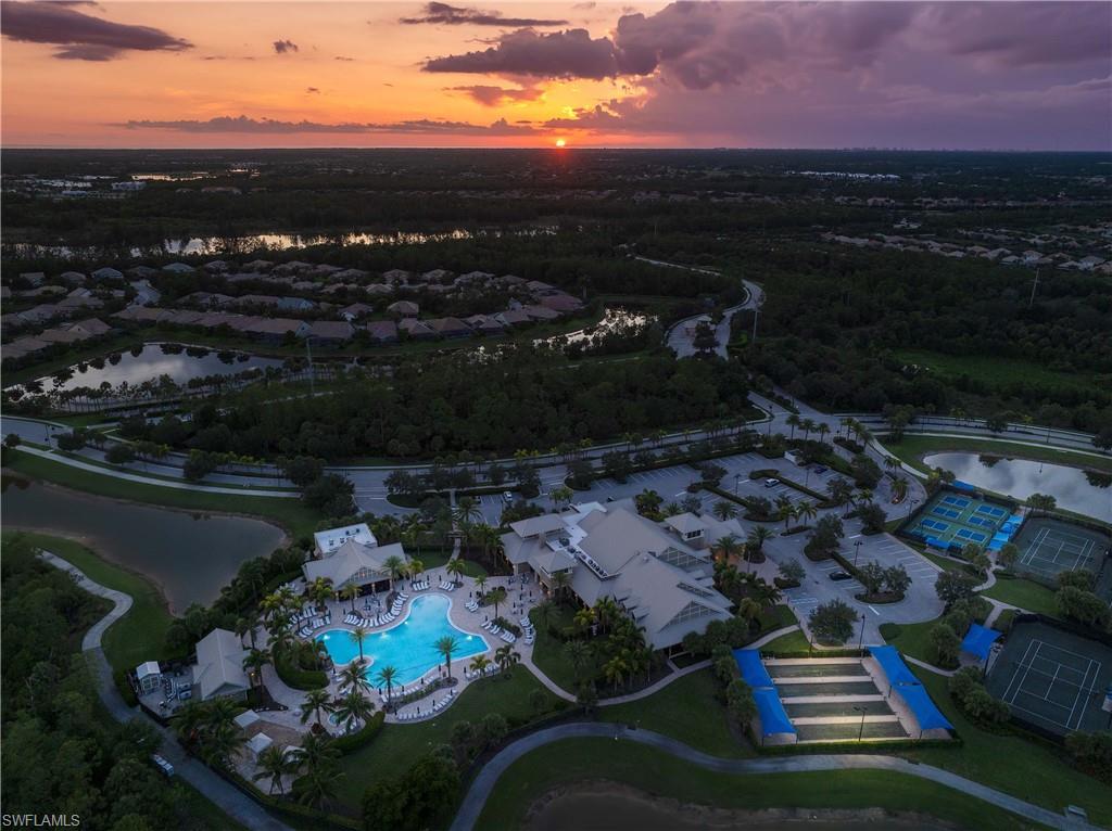 7658 Jacaranda Lane Naples, FL 34114 - Photo 29 of 30 Aerial view at dusk of community center