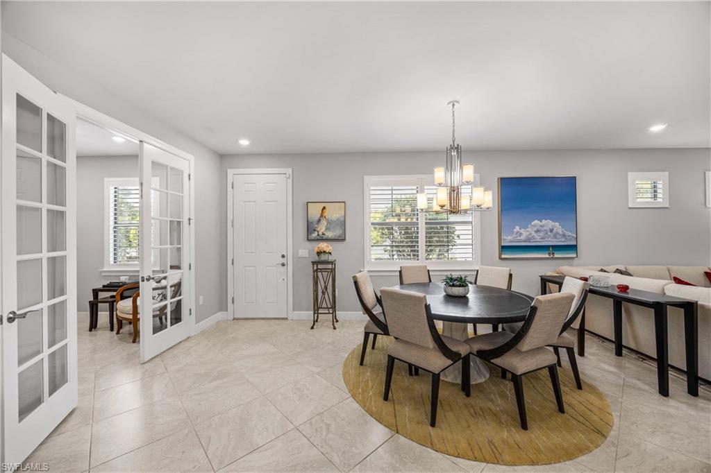 7658 Jacaranda Lane Naples, FL 34114 - Photo 3 of 30 Dining area with entrance to den with French doors