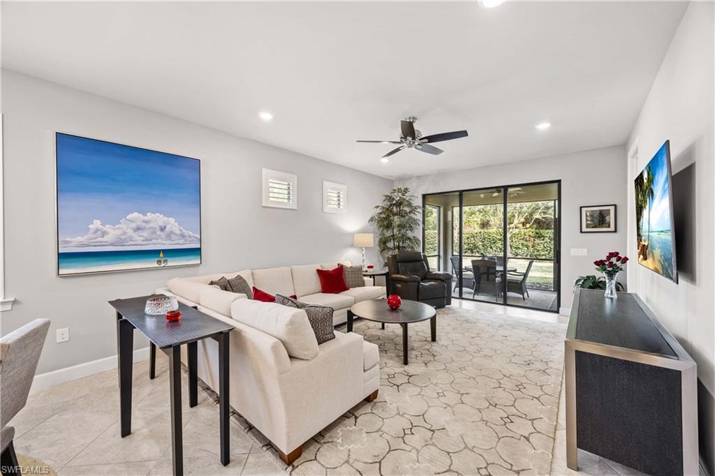 7658 Jacaranda Lane Naples, FL 34114 - Photo 4 of 30 Living area featuring a ceiling fan and recessed lighting sliding doors lead to covered lanai