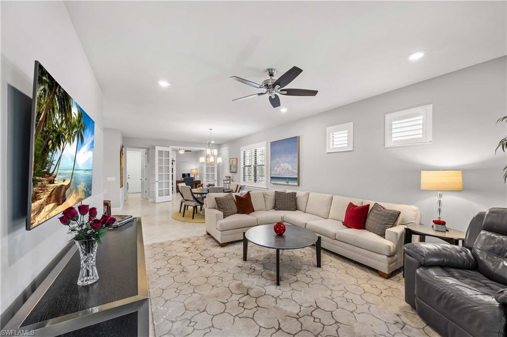 7658 Jacaranda Lane Naples, FL 34114 - Photo 5 of 30 Living area open and spacious connects to dining area