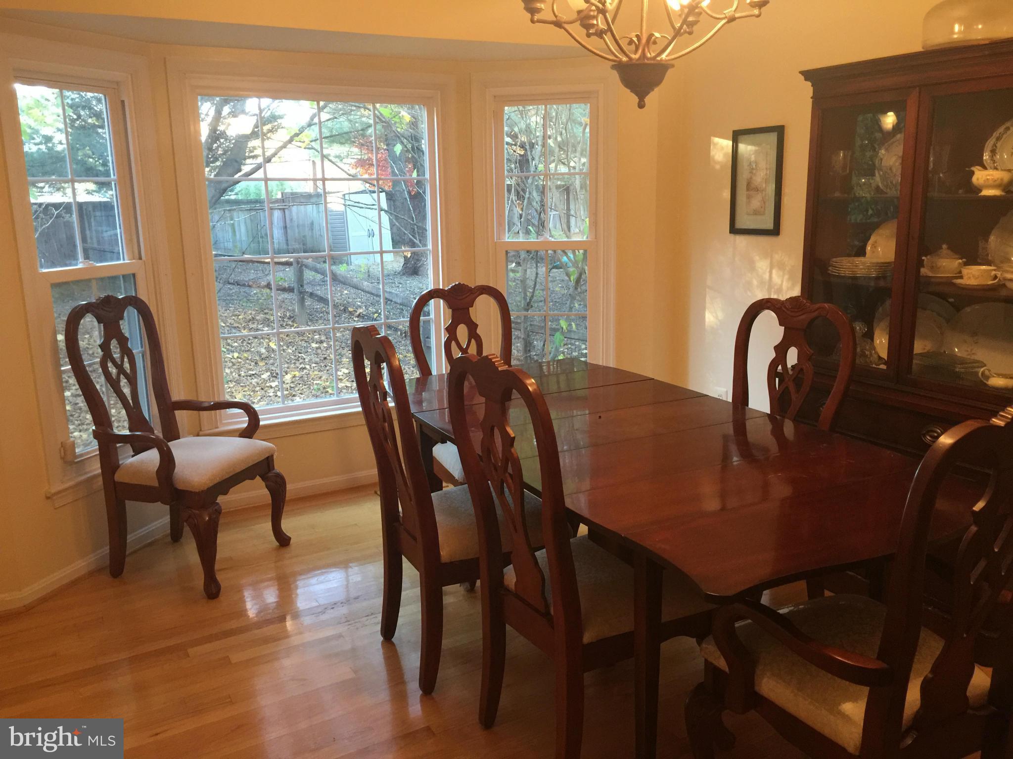 18801 Lindenhouse Road Gaithersburg, MD 20879 - Photo 3 of 22 a view of a a dining room with furniture window and outside view