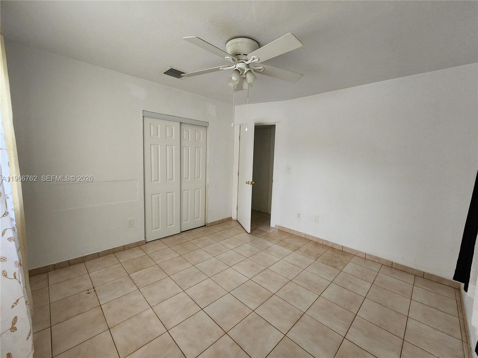 16311 Southwest 102nd Place, Unit A Miami, FL 33157 - Photo 13 of 15 wooden floor in an empty room