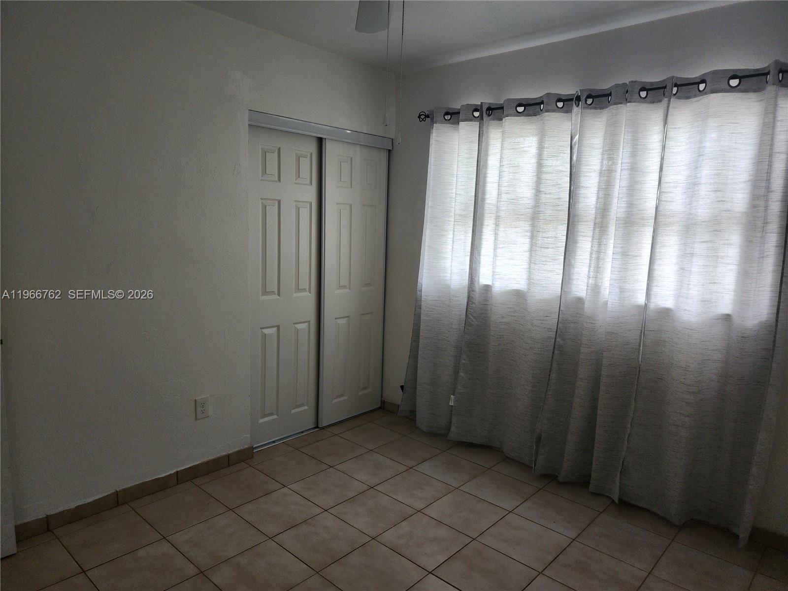 16311 Southwest 102nd Place, Unit A Miami, FL 33157 - Photo 14 of 15 a view of empty room with wooden floor