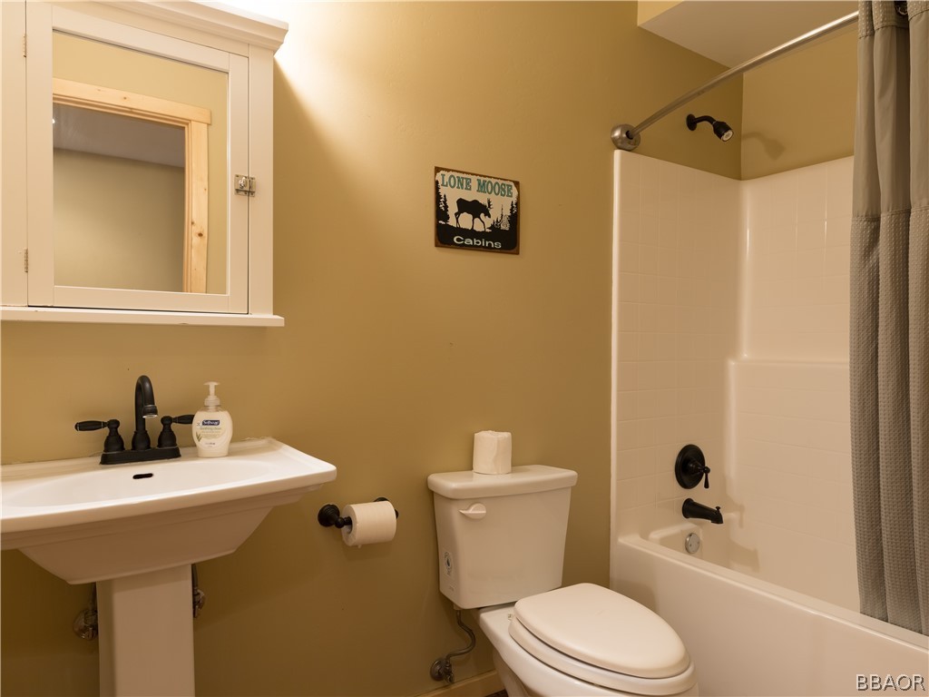 630 Summit Boulevard Big Bear Lake, CA 92315 - Photo 12 of 33 a bathroom with a sink mirror toilet and shower