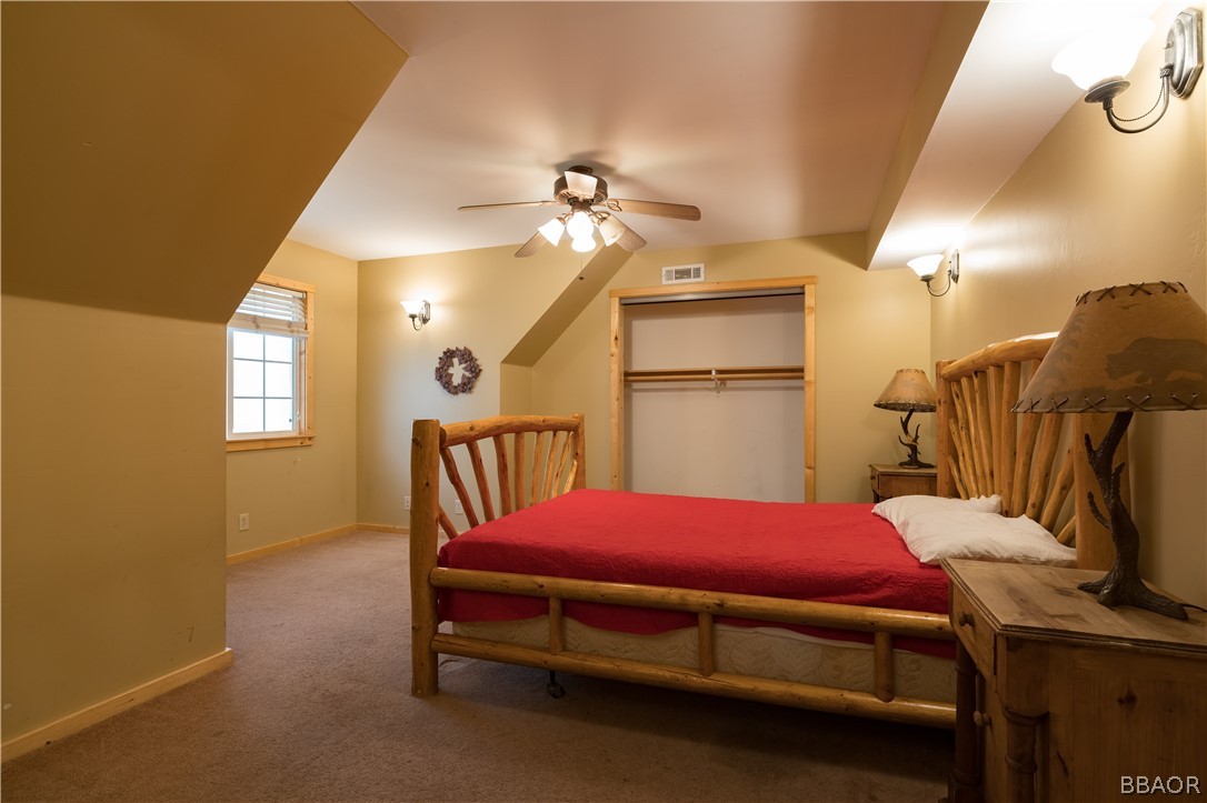 630 Summit Boulevard Big Bear Lake, CA 92315 - Photo 19 of 33 a bedroom with a bed and a window