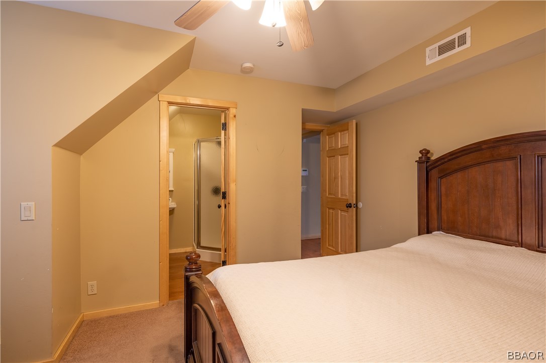 630 Summit Boulevard Big Bear Lake, CA 92315 - Photo 24 of 33 a bedroom with a bed and a table