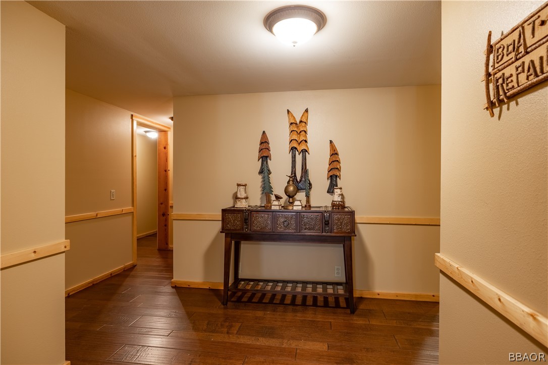 630 Summit Boulevard Big Bear Lake, CA 92315 - Photo 26 of 33 a view of a hallway with wooden floor