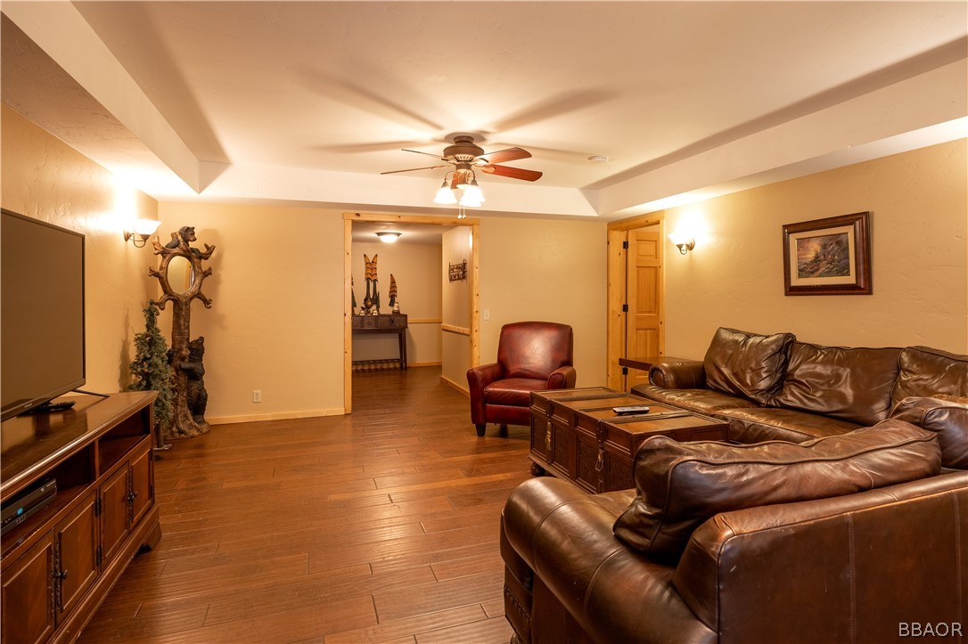 630 Summit Boulevard Big Bear Lake, CA 92315 - Photo 3 of 33 a living room with furniture and a flat screen tv