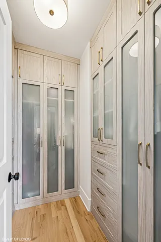 a spacious bathroom with a double vanity sink mirror and shower