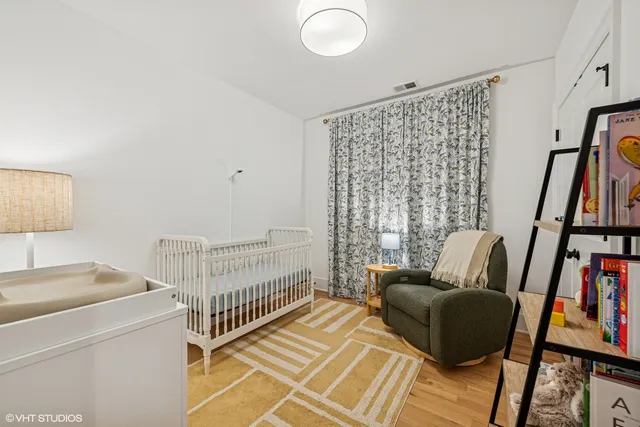 a bathroom with a double vanity sink toilet and shower
