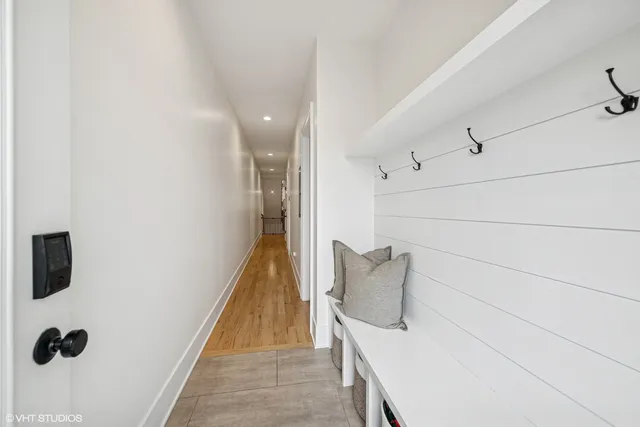 a view of a patio with table and chairs a barbeque with wooden floor and fence