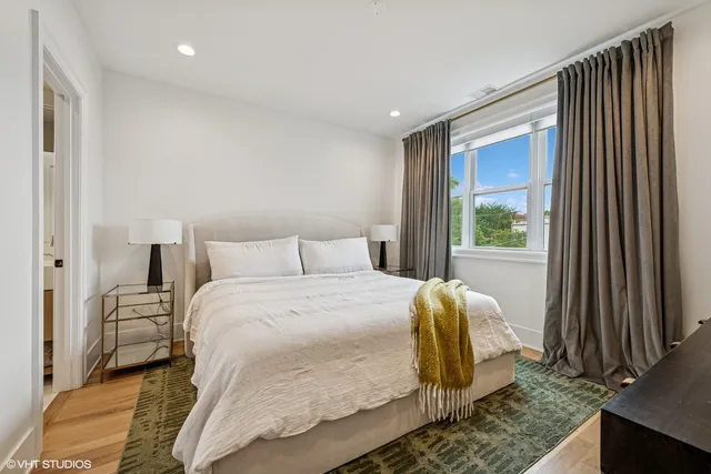 a bedroom with a bed and a dresser