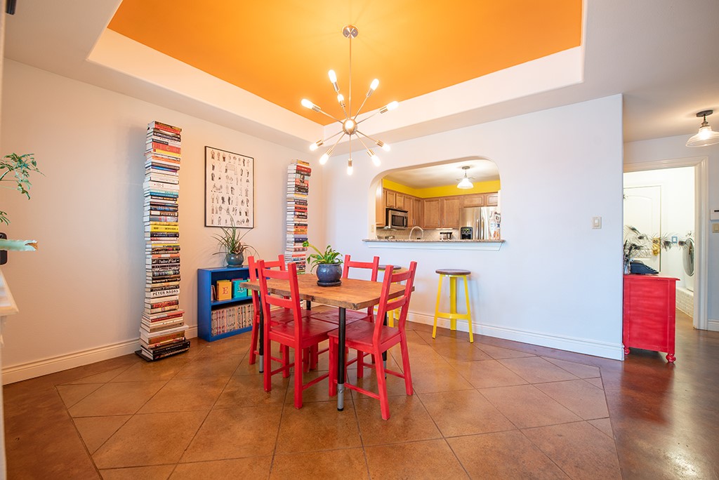 3609 Clawson Road, Unit A Austin, TX 78704 - Photo 5 of 17 A spacious dining area seamlessly flows into the kitchen through a charming pass-through window.
