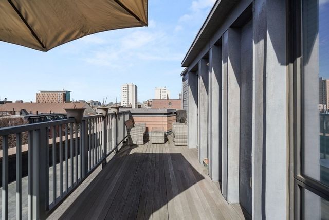 a balcony with view of city