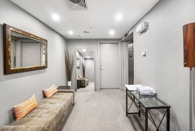 a bedroom with furniture and a chair