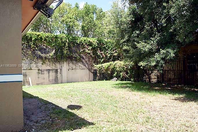 601 Northwest 97th Street, Unit 601 Miami, FL 33150 - Photo 12 of 16 a view of a backyard