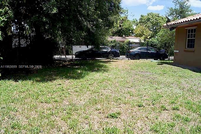 601 Northwest 97th Street, Unit 601 Miami, FL 33150 - Photo 13 of 14 a view of a garden with plants and a bench