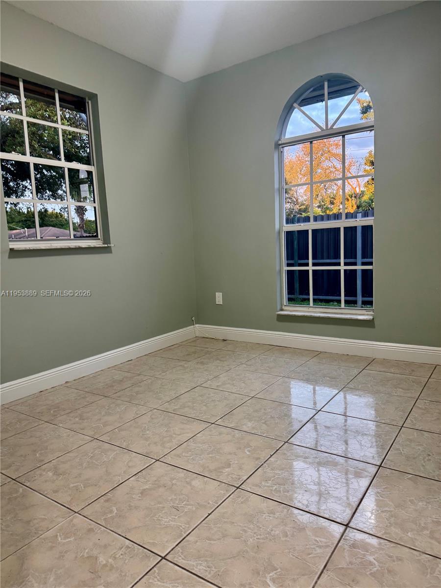 601 Northwest 97th Street, Unit 601 Miami, FL 33150 - Photo 15 of 16 a view of empty room with windows