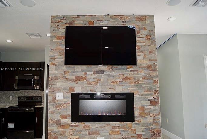 601 Northwest 97th Street, Unit 601 Miami, FL 33150 - Photo 3 of 14 a fireplace