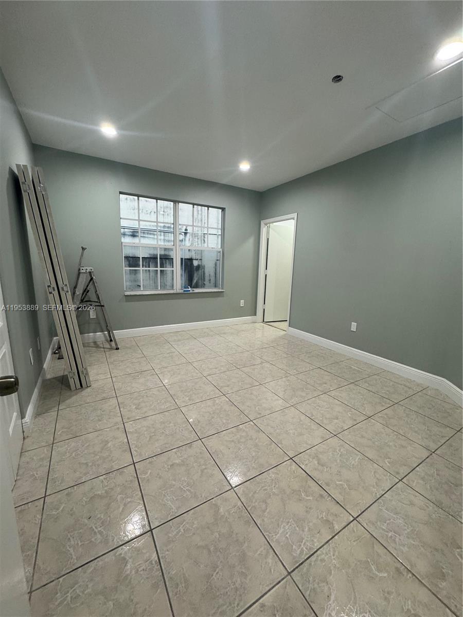 601 Northwest 97th Street, Unit 601 Miami, FL 33150 - Photo 7 of 16 a view of an empty room with a fireplace