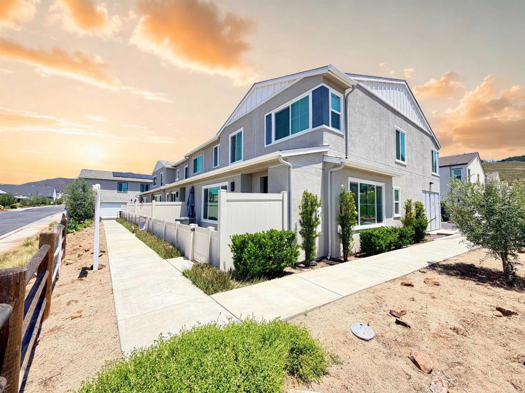 35104 Crop Place Fallbrook, CA 92028 - Photo 2 of 13 a front view of a house with a yard