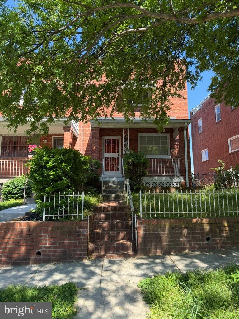 42 54th Street Southeast Washington, DC 20019 - Photo 1 of 7 a front view of a house with a garden