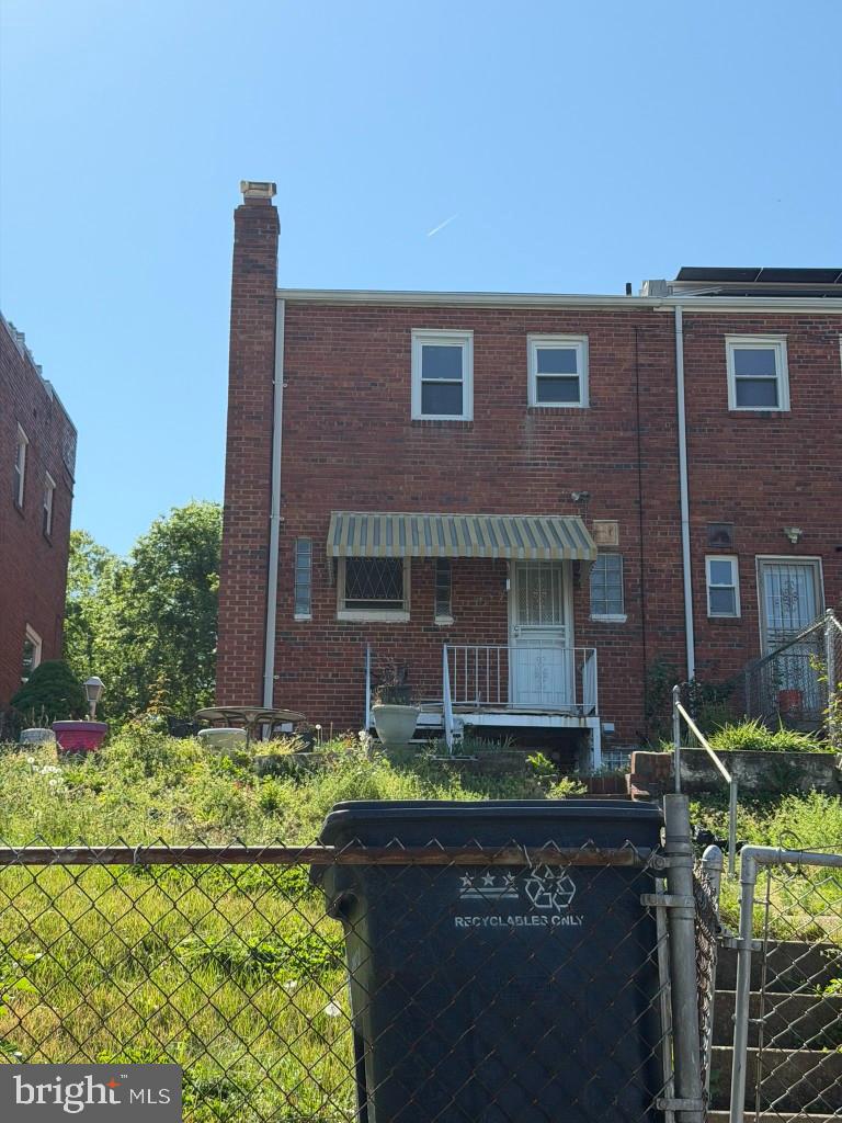 42 54th Street Southeast Washington, DC 20019 - Photo 6 of 7 a front view of a house with a garden
