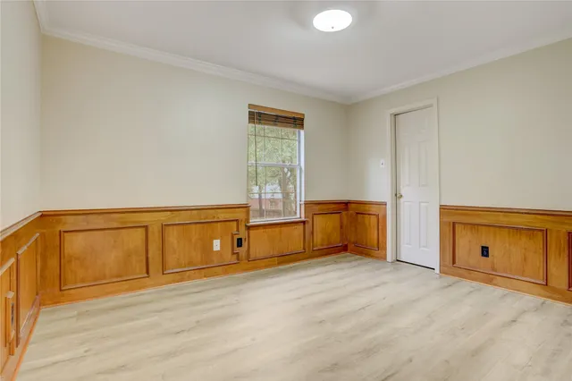 a bathroom with a granite countertop sink a toilet and a bathtub