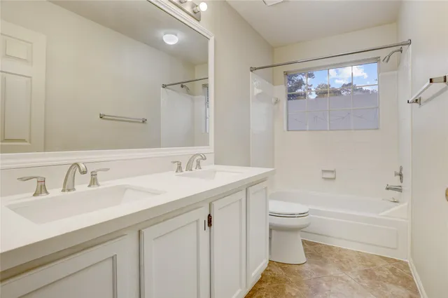 a view of backyard with wooden fence and large trees