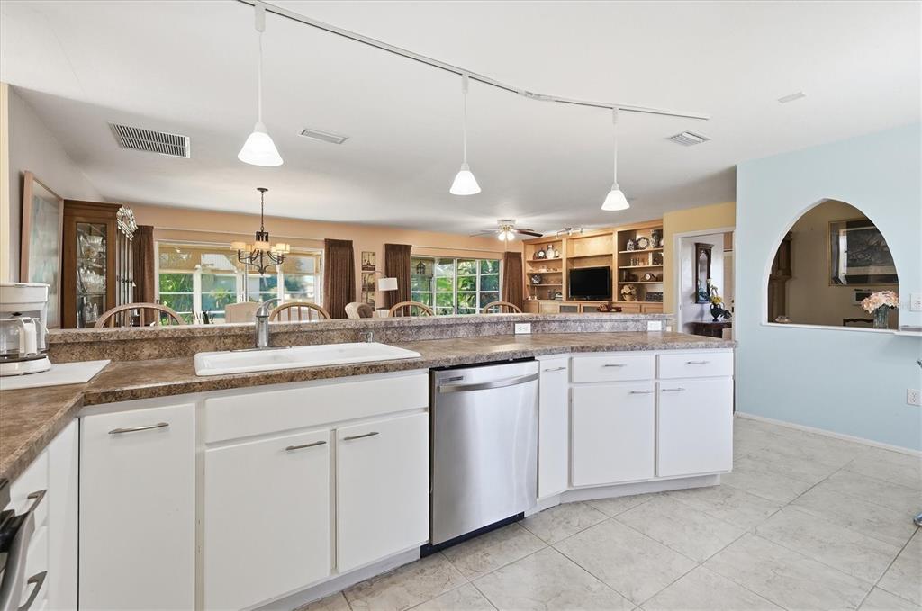1802 69th Street West Bradenton, FL 34209 - Photo 15 of 31 a large kitchen with cabinets and wooden floors