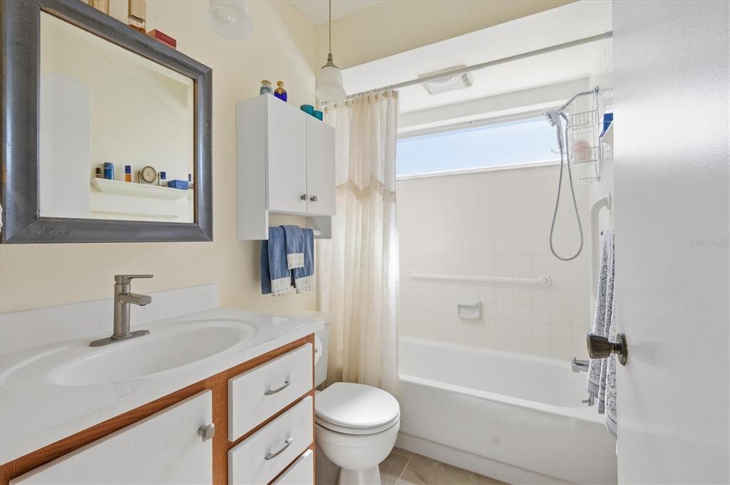 1802 69th Street West Bradenton, FL 34209 - Photo 20 of 31 a bathroom with a sink a toilet and shower