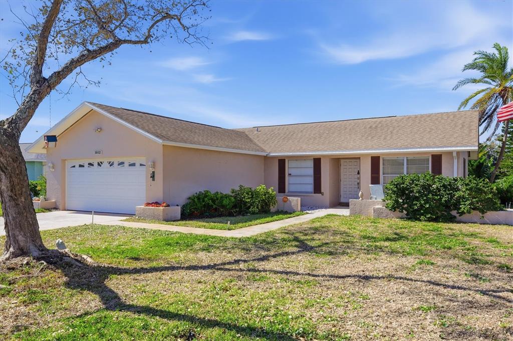 1802 69th Street West Bradenton, FL 34209 - Photo 2 of 31 a front view of house with yard and green space
