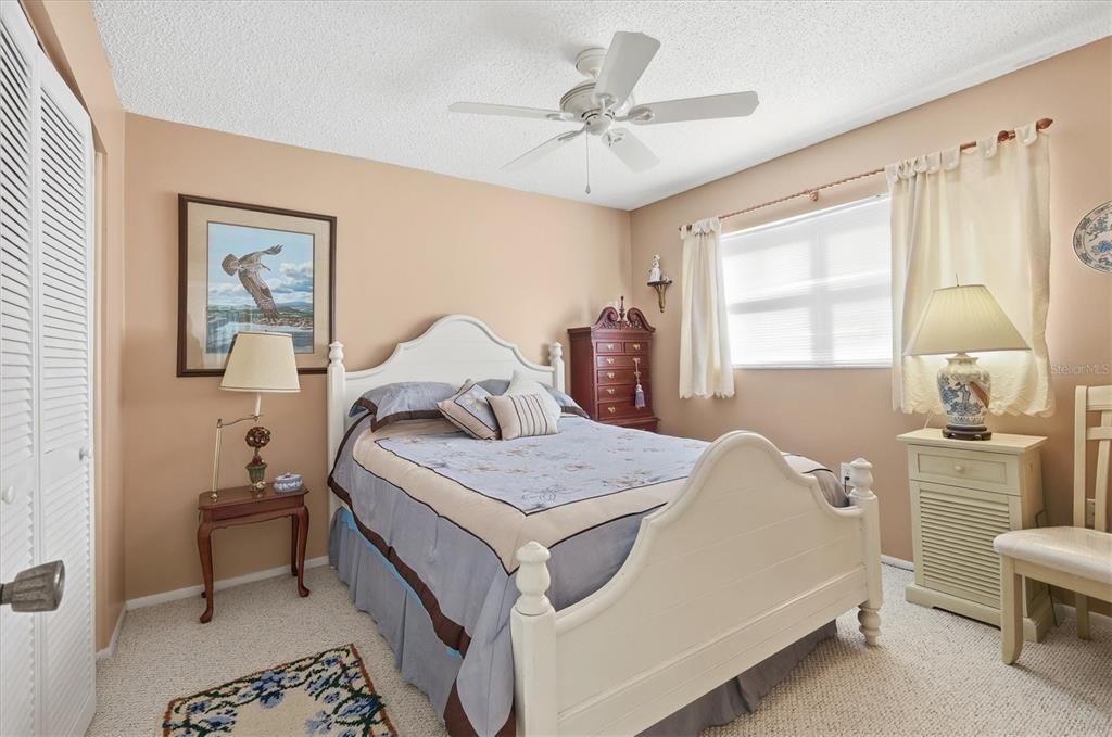 1802 69th Street West Bradenton, FL 34209 - Photo 21 of 31 a bedroom with a bed and a table in it