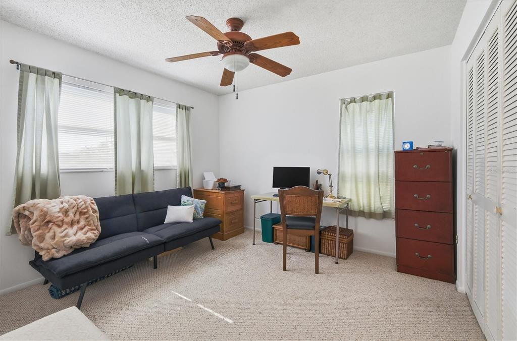 1802 69th Street West Bradenton, FL 34209 - Photo 23 of 31 a living room with furniture and a window