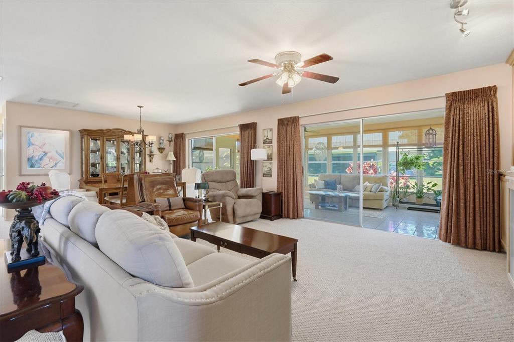 1802 69th Street West Bradenton, FL 34209 - Photo 8 of 31 a living room with furniture and a large window