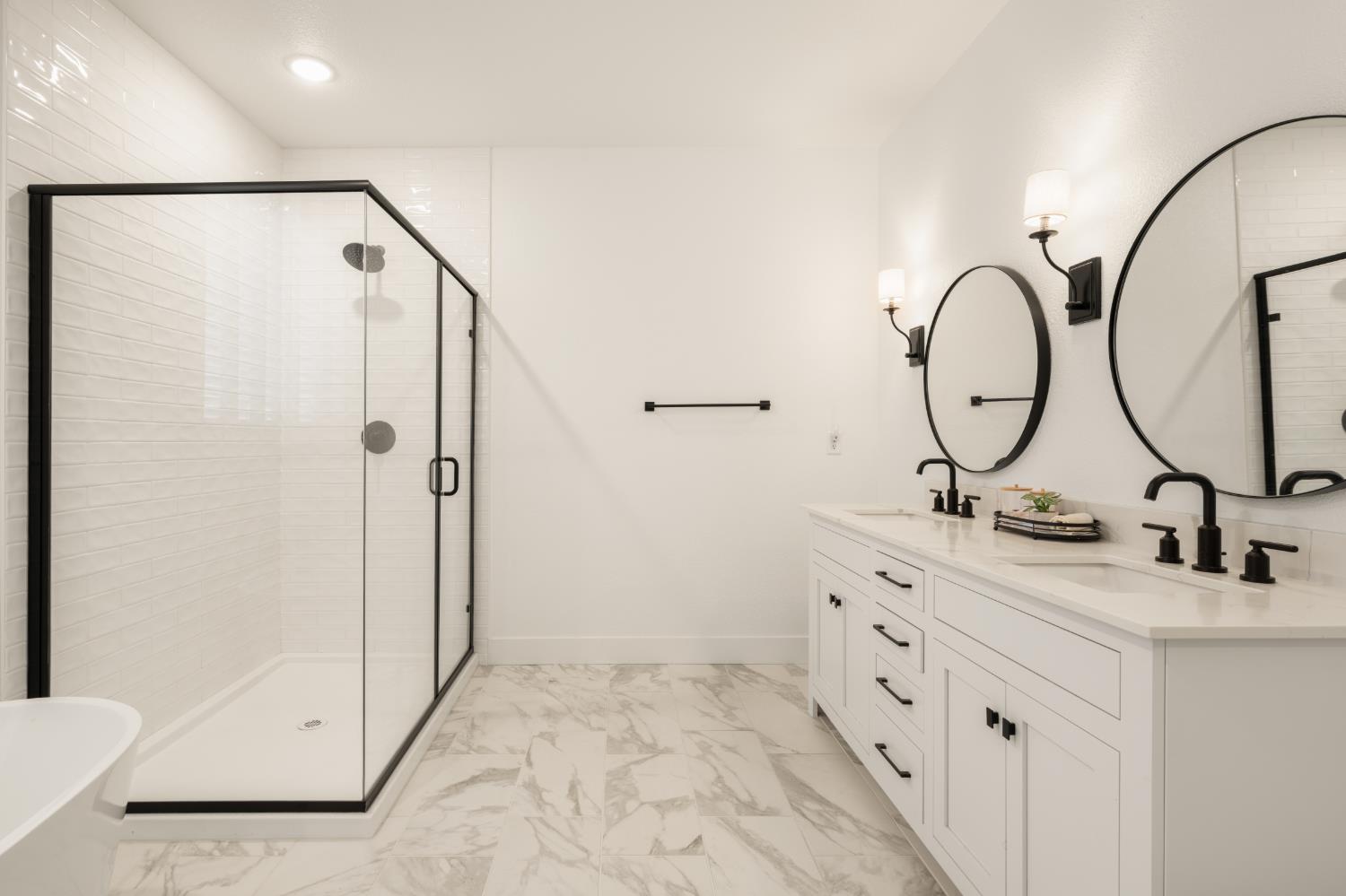 4216 Creede Way Rancho Cordova, CA 95742 - Photo 29 of 56 a bathroom with double sink and a mirror