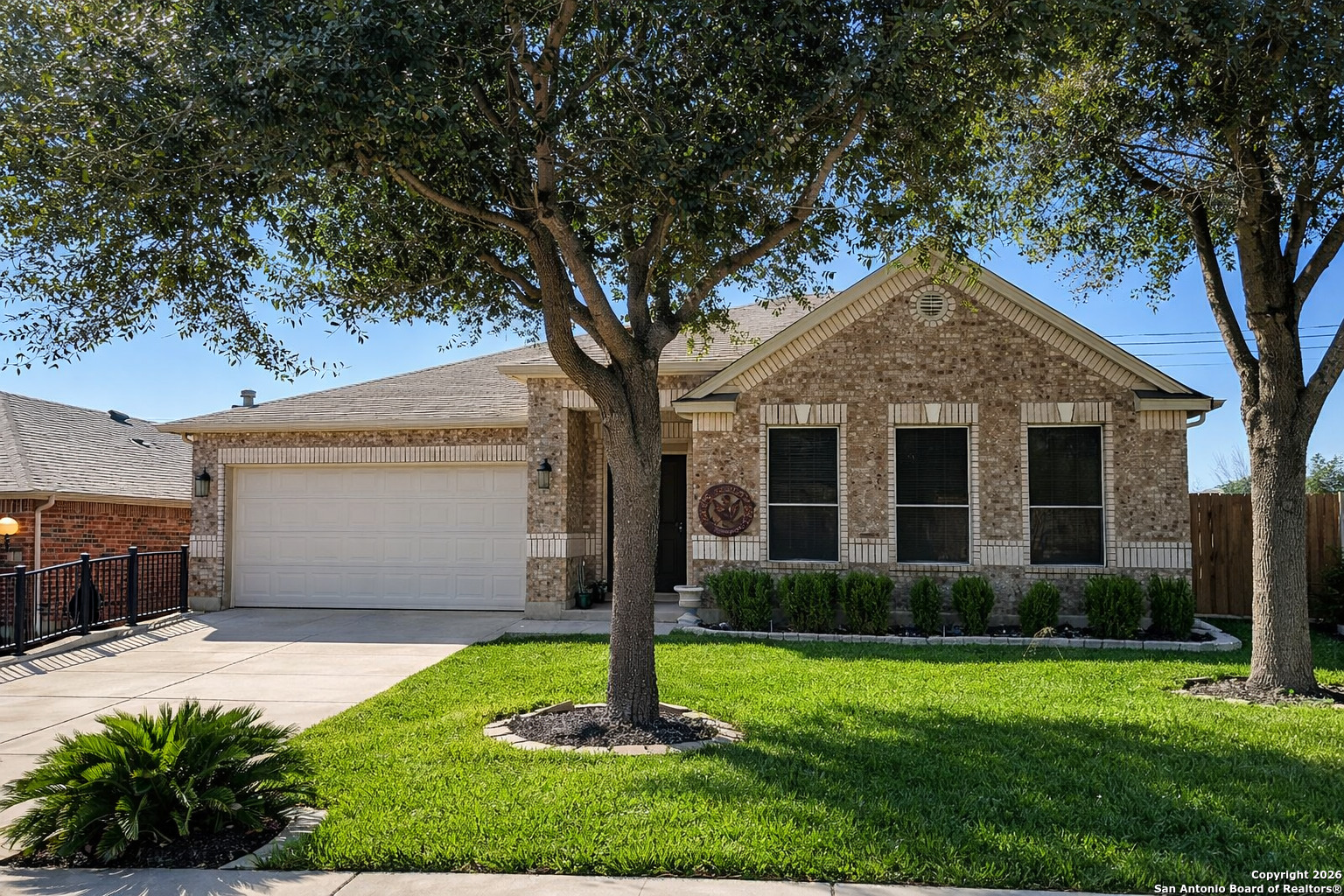 141 Springtree Gate Cibolo, TX 78108 - Photo 2 of 8 a front view of a house with a yard and porch