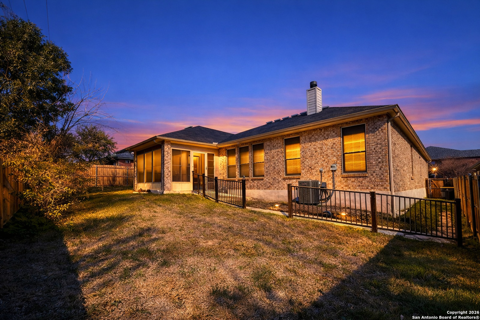 141 Springtree Gate Cibolo, TX 78108 - Photo 3 of 8 a front view of house with yard outdoor seating and barbeque oven