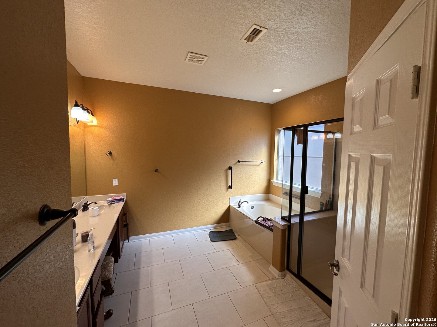 141 Springtree Gate Cibolo, TX 78108 - Photo 8 of 8 a kitchen with stainless steel appliances a refrigerator and a stove