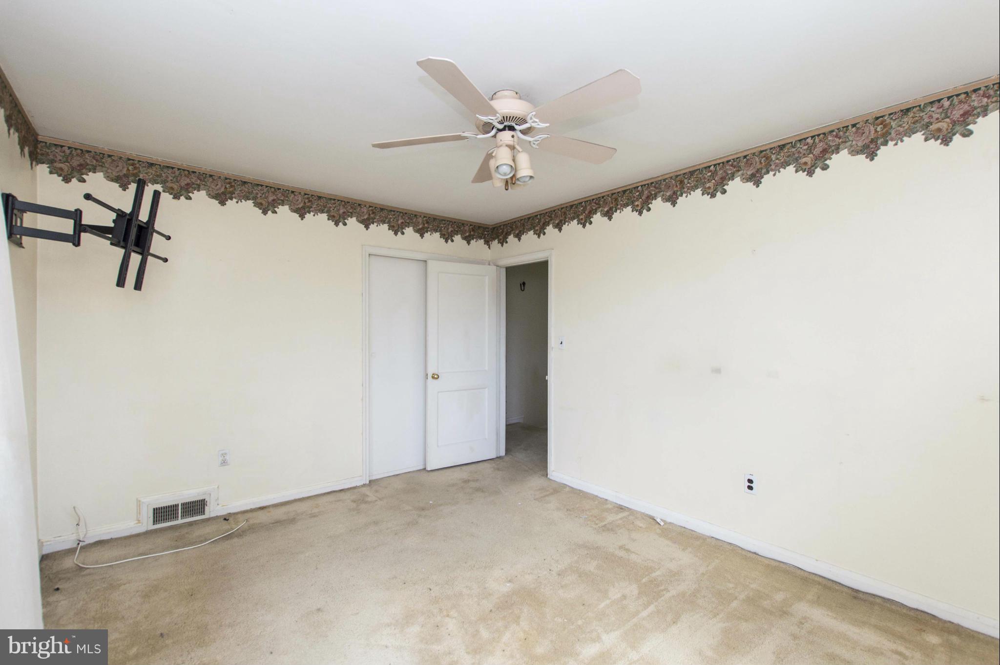 1254 Cedarcroft Road Baltimore, MD 21239 - Photo 16 of 30 a view of a room with a ceiling fan
