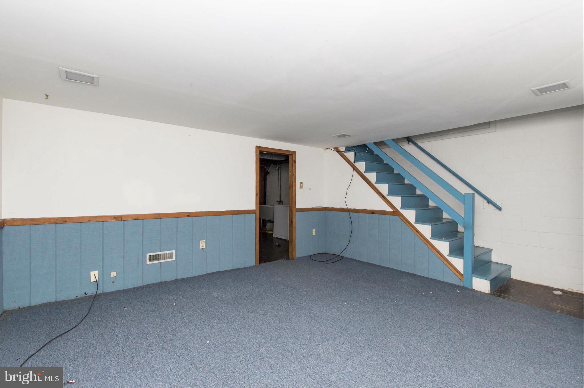 1254 Cedarcroft Road Baltimore, MD 21239 - Photo 23 of 30 a view of an empty room with stairs