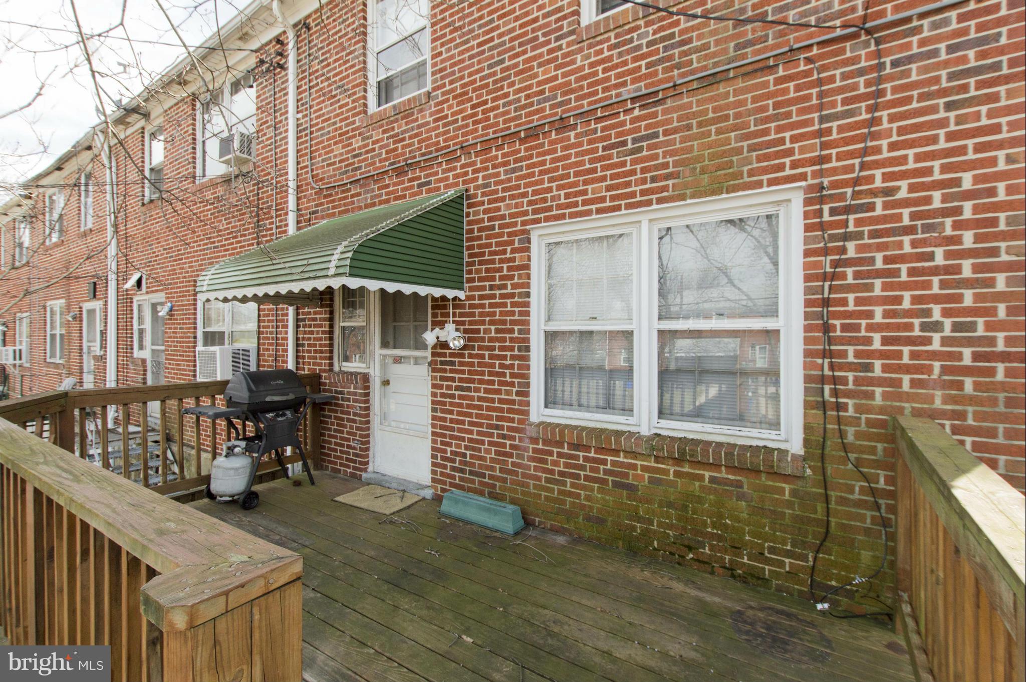 1254 Cedarcroft Road Baltimore, MD 21239 - Photo 25 of 30 a view of a house with wooden deck