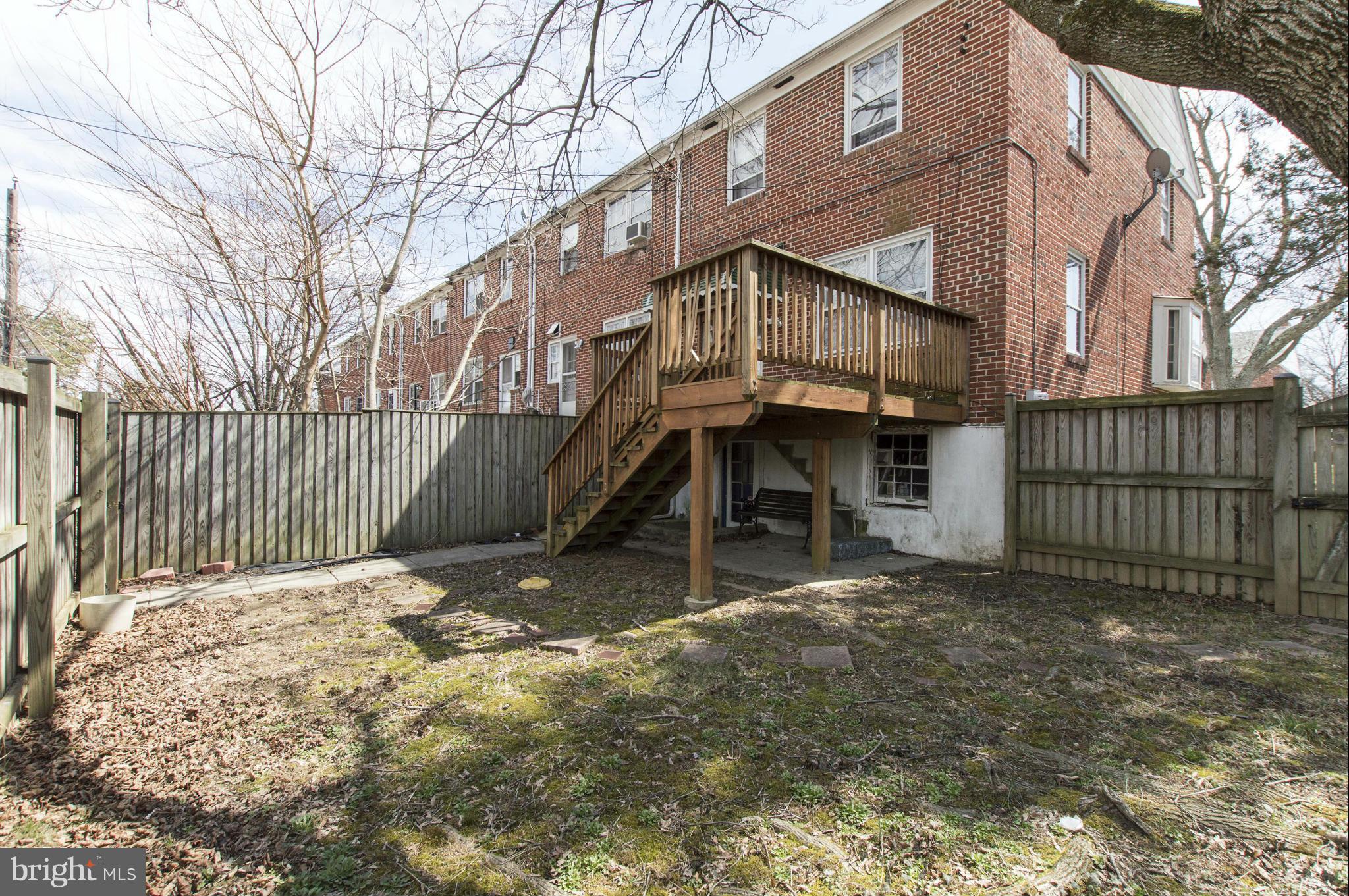 1254 Cedarcroft Road Baltimore, MD 21239 - Photo 28 of 30 a view of a house with a wooden fence