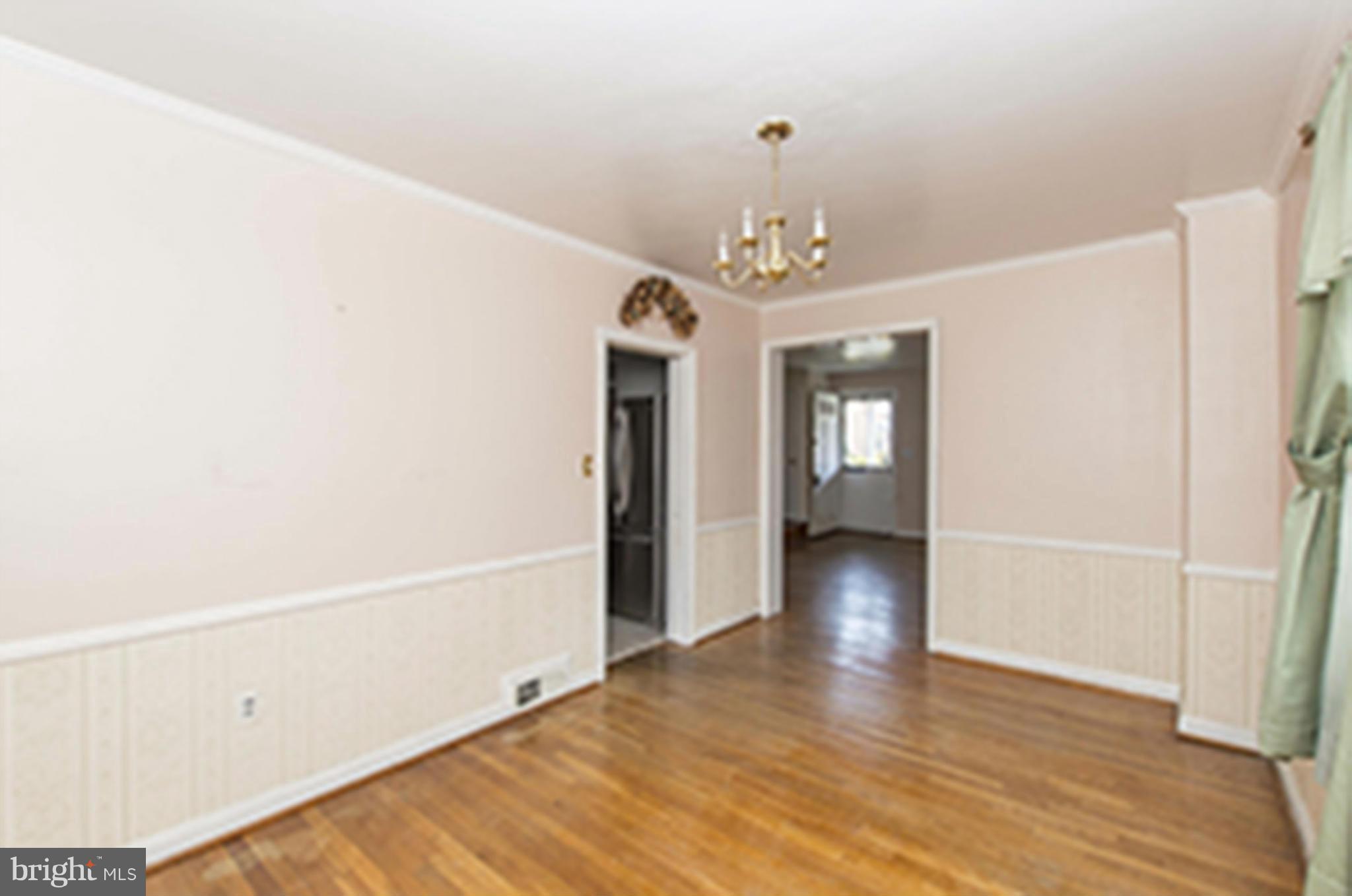 1254 Cedarcroft Road Baltimore, MD 21239 - Photo 7 of 30 a view of livingroom with hardwood floor and hallway