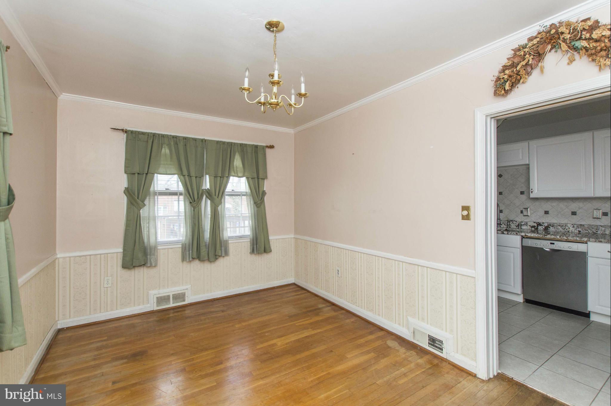 1254 Cedarcroft Road Baltimore, MD 21239 - Photo 8 of 30 a view of an empty room with a window