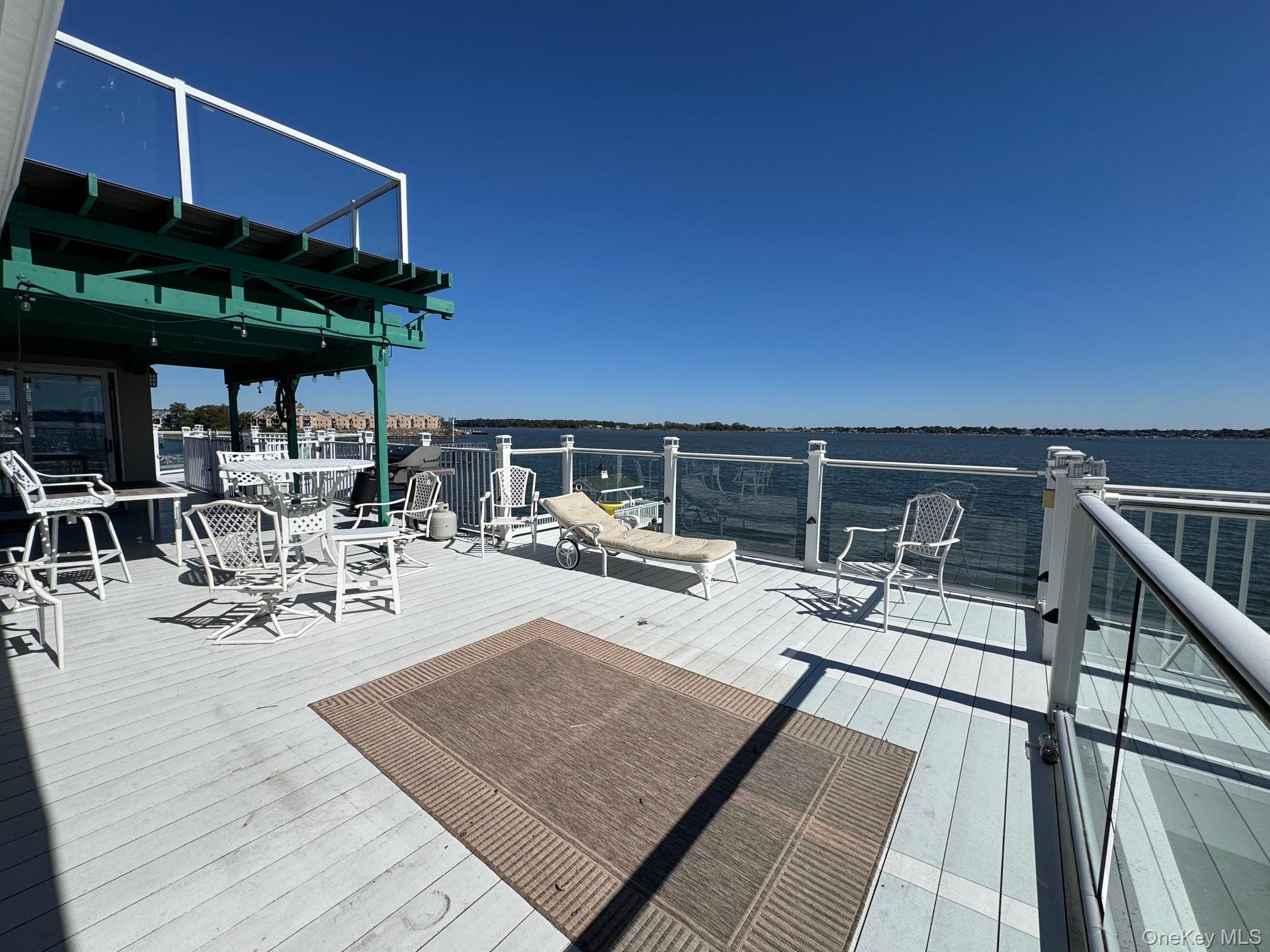 Wooden deck featuring a water view