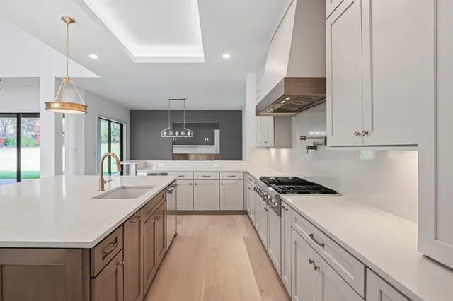 a large bathroom with a double vanity sink and mirror